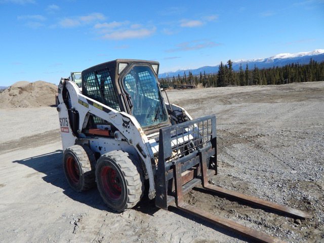 Bobcat skid steer with forks